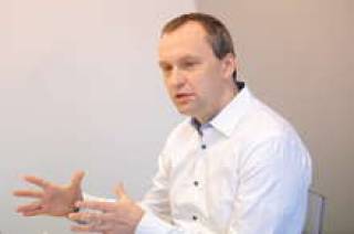 Партнер Ernst &amp; Young Андрис Лауциньш.