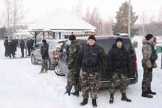 Собрание акционеров Latvijas кuģniecība прошло в микроавтобусе под усиленной охраной.