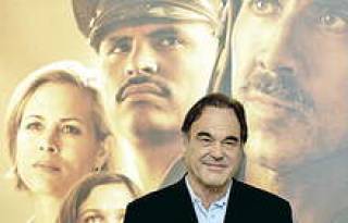 Оливер Стоун на фоне своих героев.